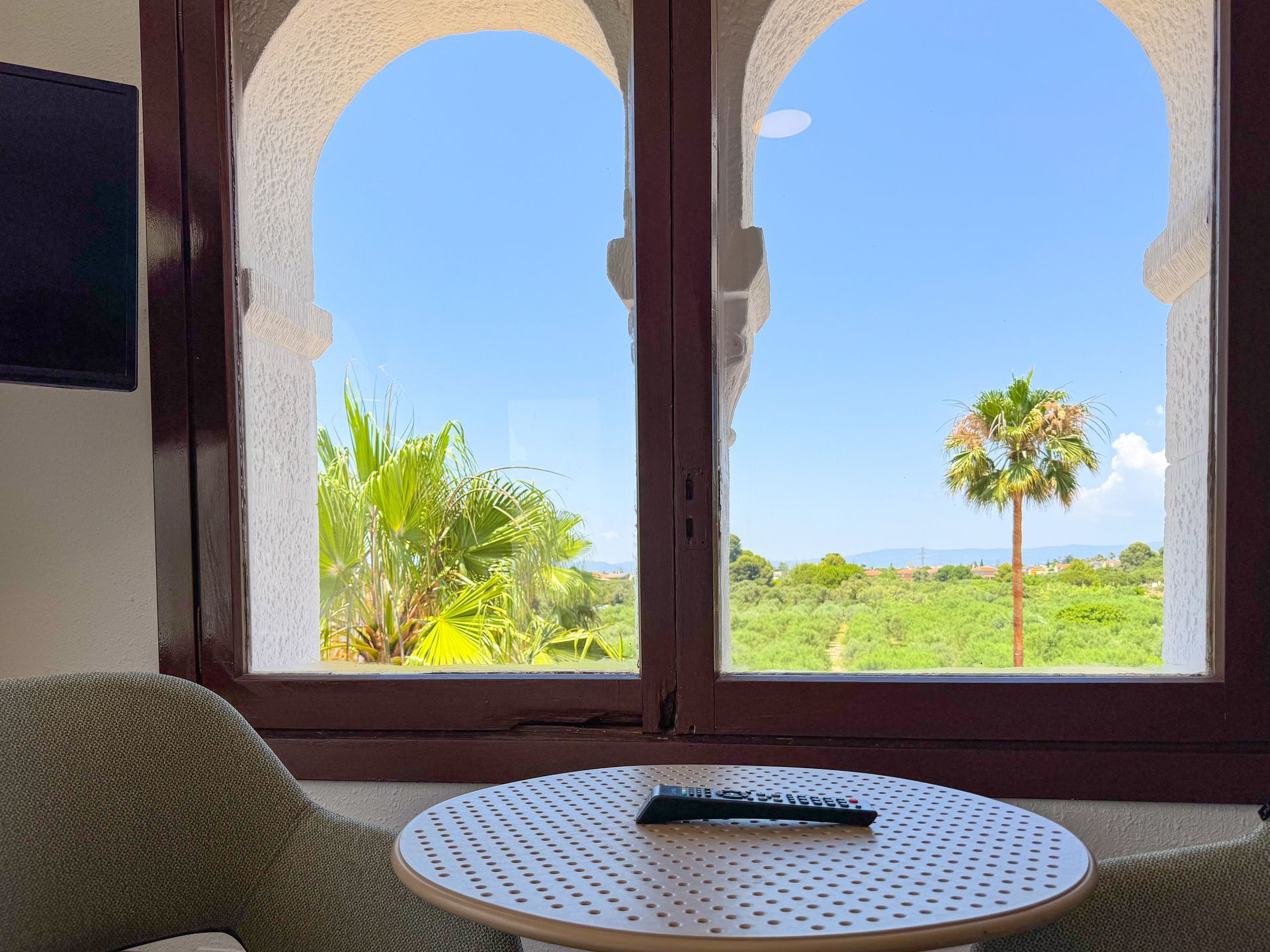 A bathroom with a walk in shower , sink and mirror.