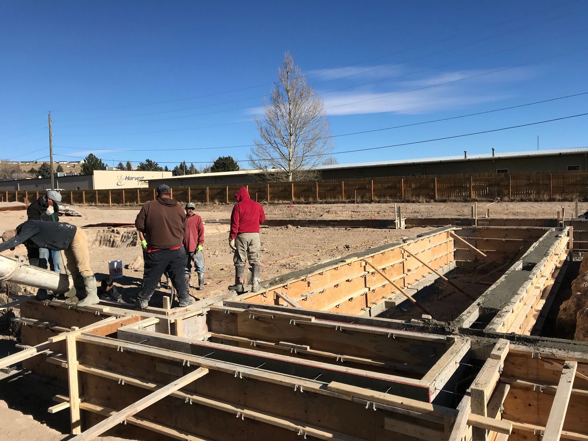 Gray stone wall with a variety of textured blocks.