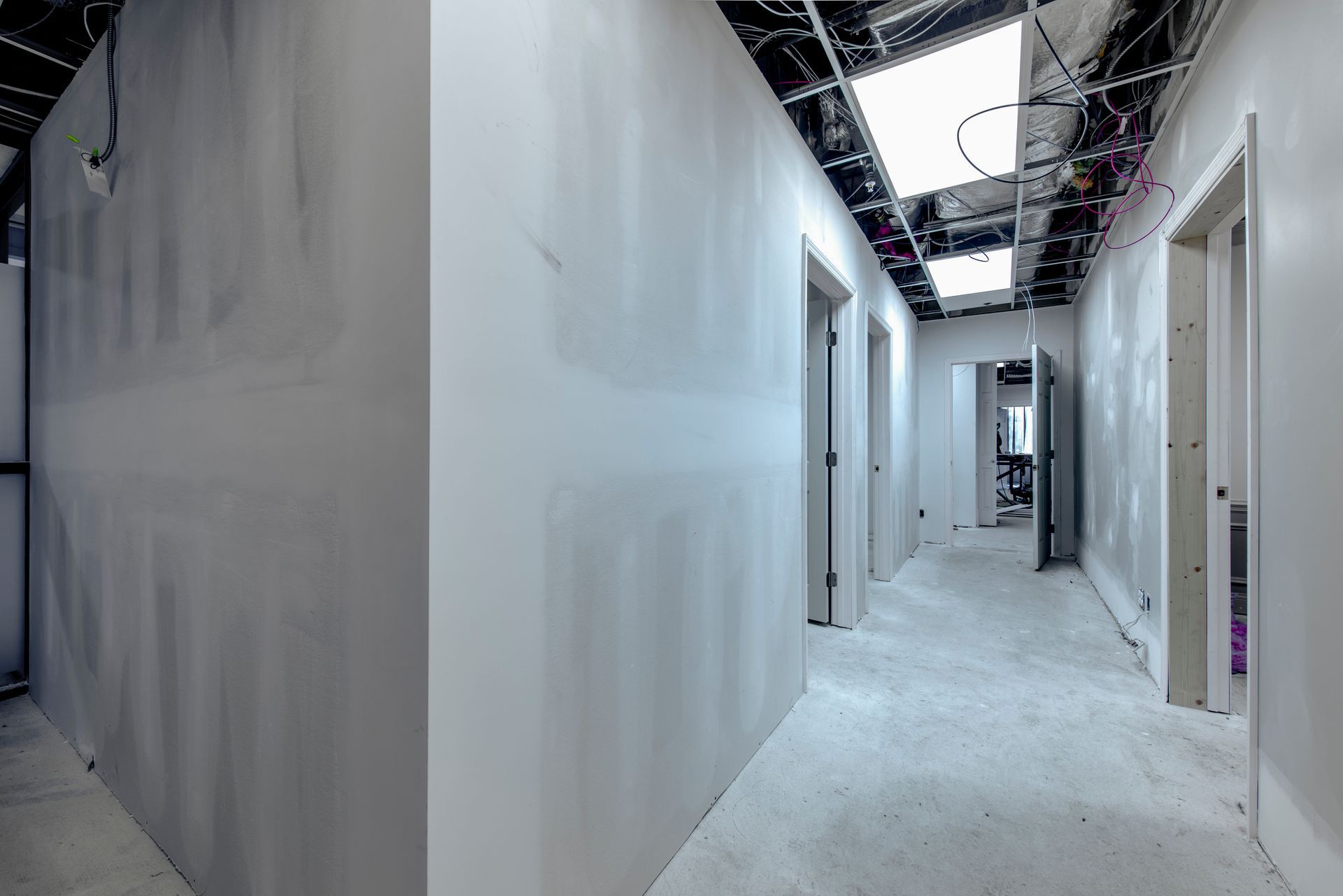 A building is being built with a crane in the foreground