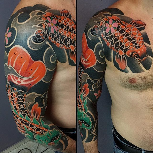 A man has a tattoo of a fish on his arm