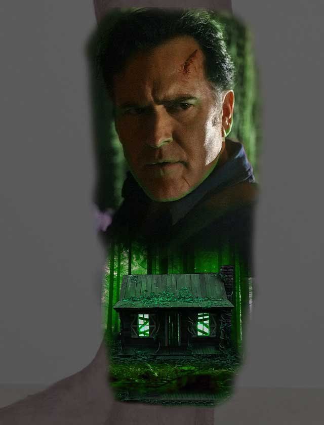 A man is standing in front of a house in the woods.