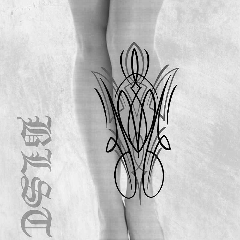 A black and white photo of a tattoo on a woman 's leg