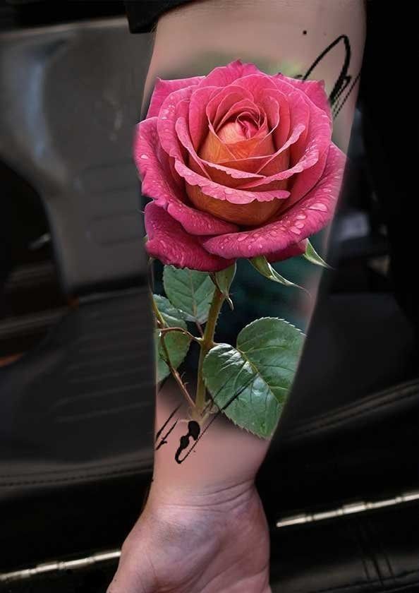 A person has a tattoo of a pink rose on their arm