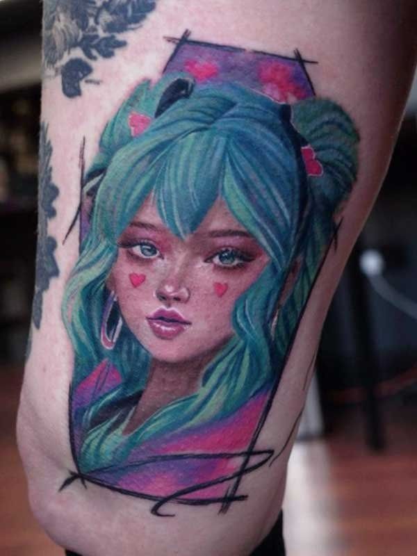 A person has a tattoo of a girl with green hair on their leg.