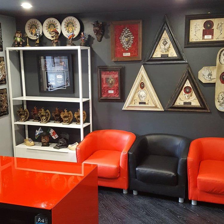 A room with red chairs and a red table