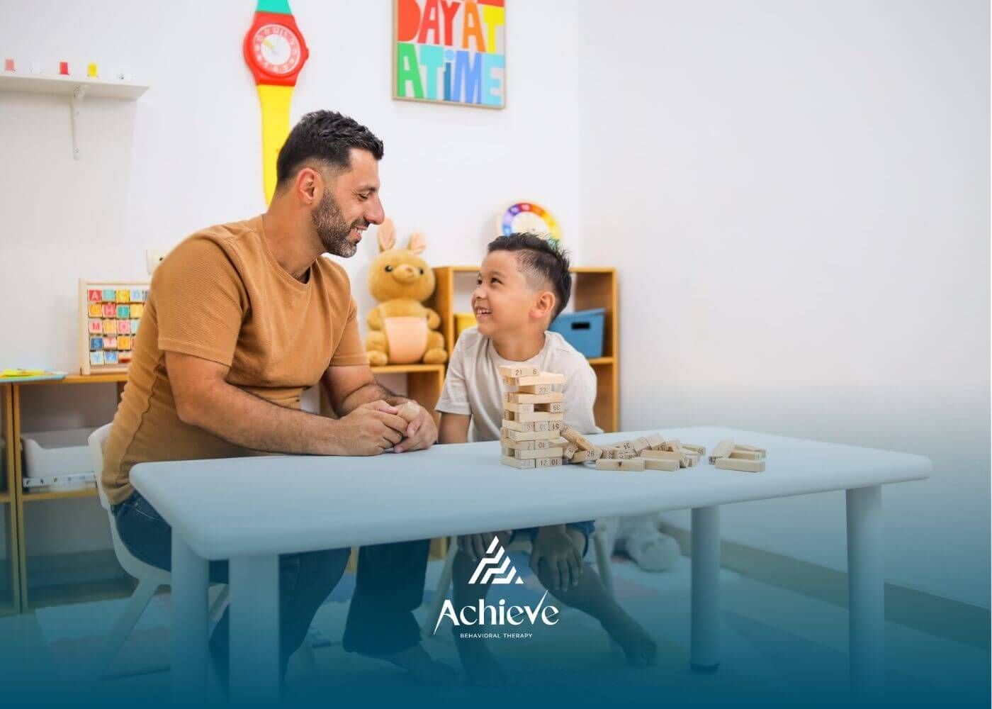 ABA therapist working with a child using blocks during an ABA therapy session.
