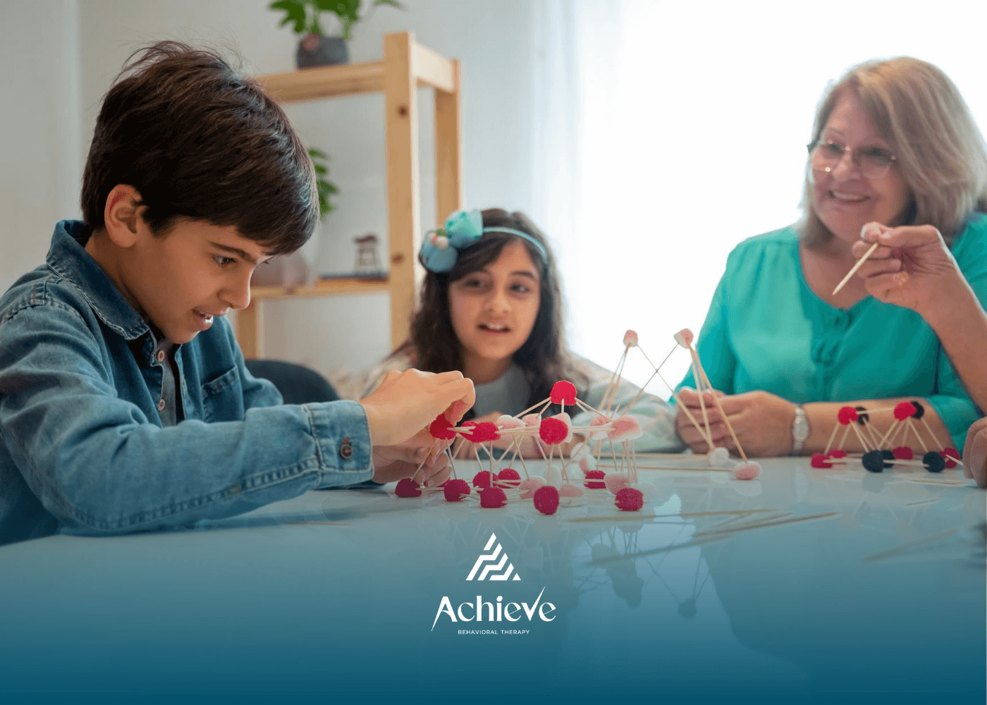 Autistic kids and RBT building models with sticks and pom-poms during school-based ABA therapy in NJ