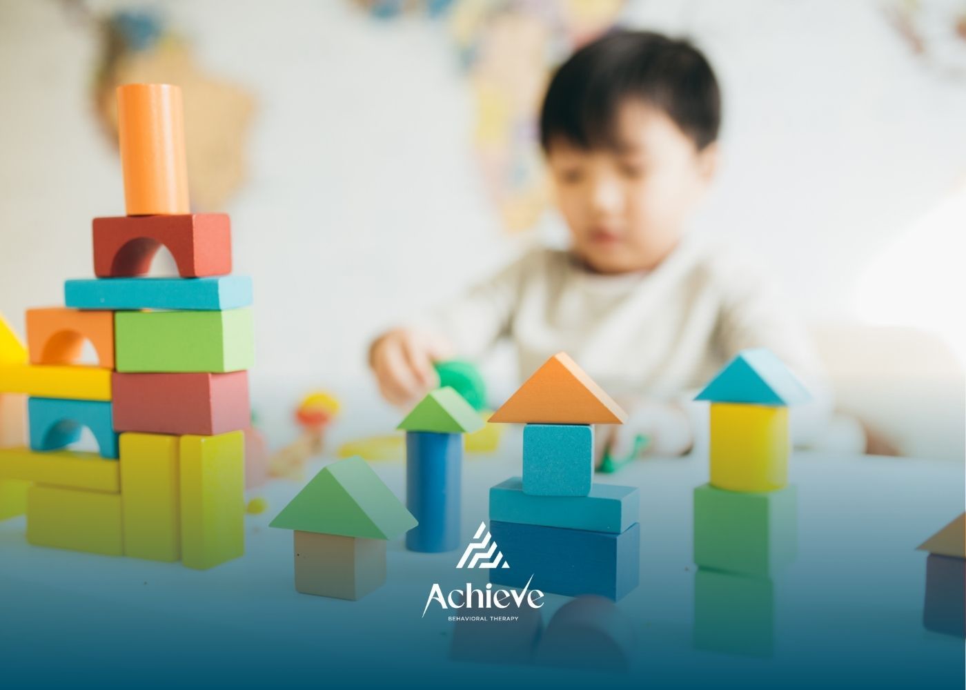 Child playing with colorful wooden blocks.
