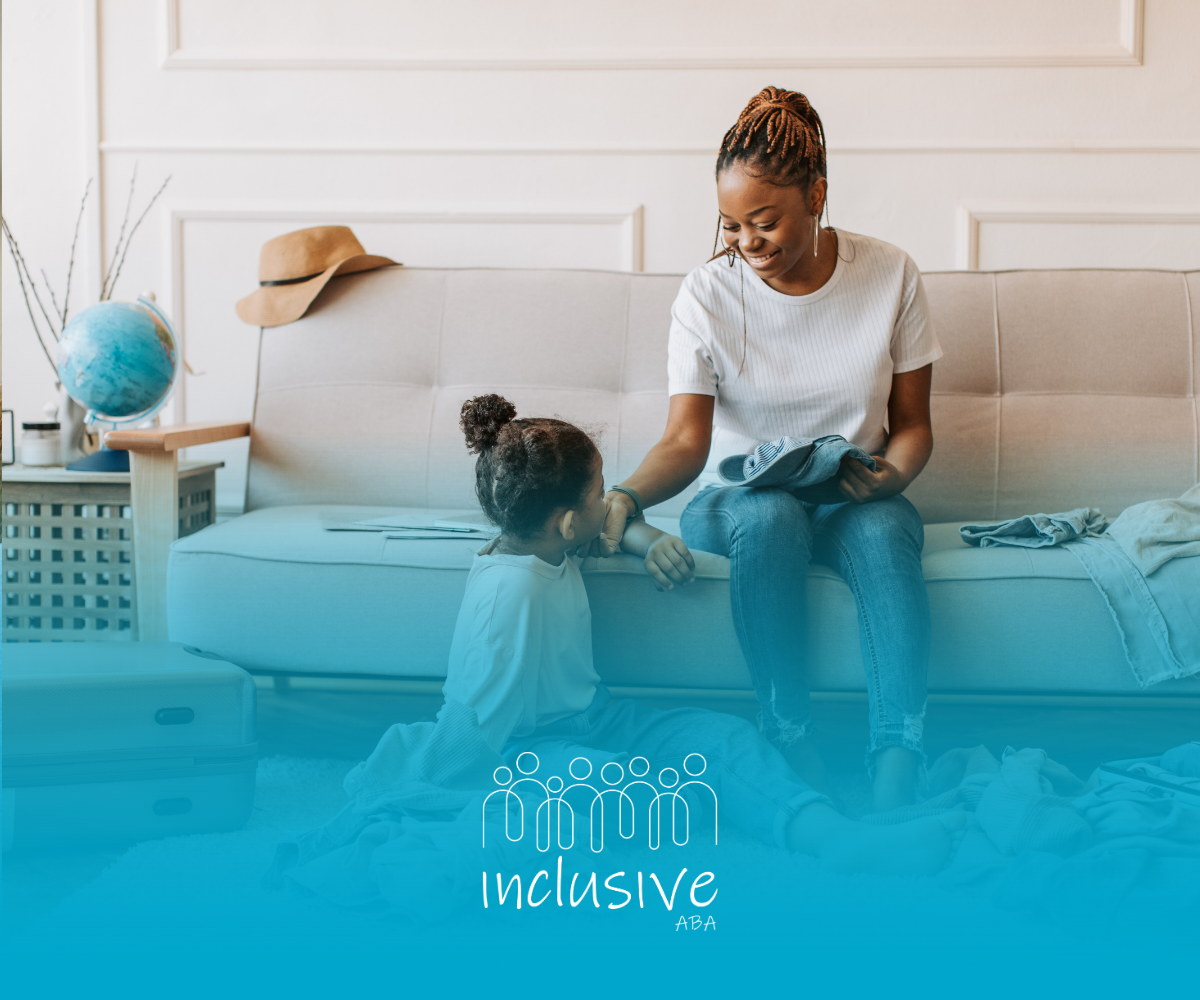A smiling adult sits on a sofa, reaching out to a child sitting on the floor in a bright, modern living room.