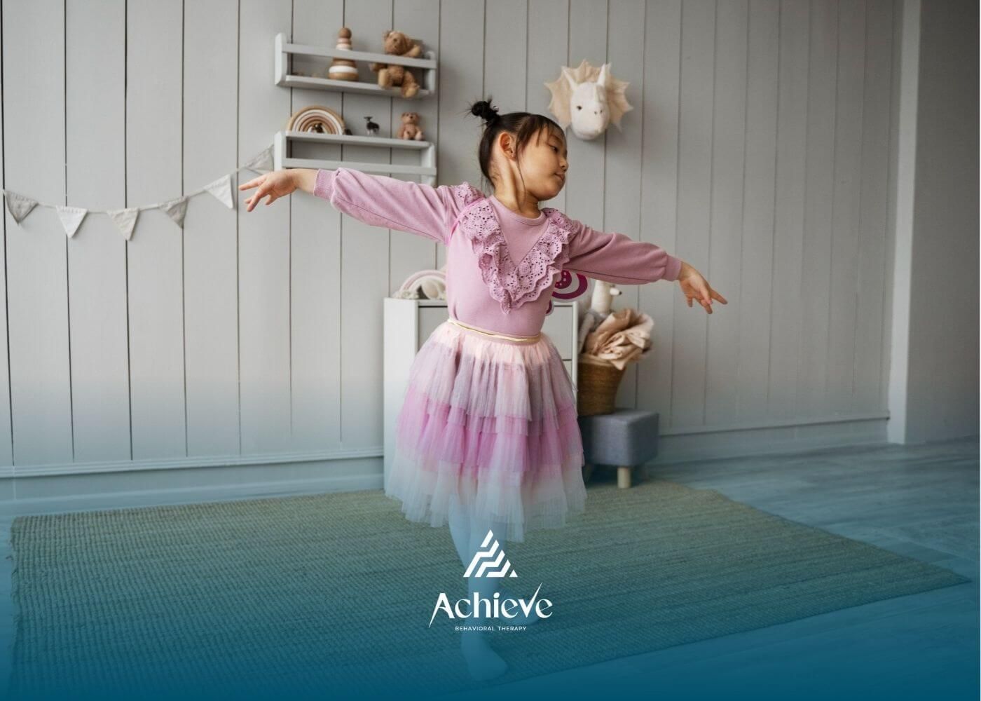 Little girl with autism in a pink tutu dress practicing a ballet pose in her bedroom.