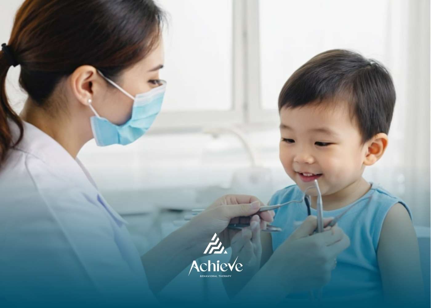 Dentist examining a young child's teeth. Dentist wearing mask, child smiling, in dental office.