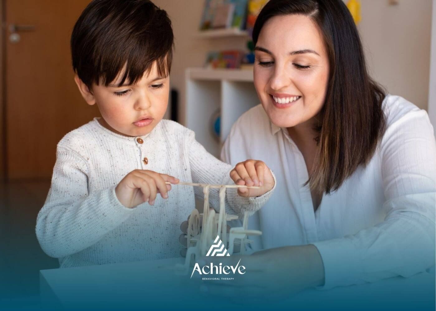 Child with autism building a wooden toy with ABA therapist guidance.