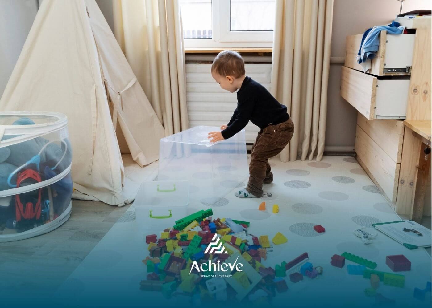 A young child is playing with colorful Lego pieces on the floor, preparing to organize them.