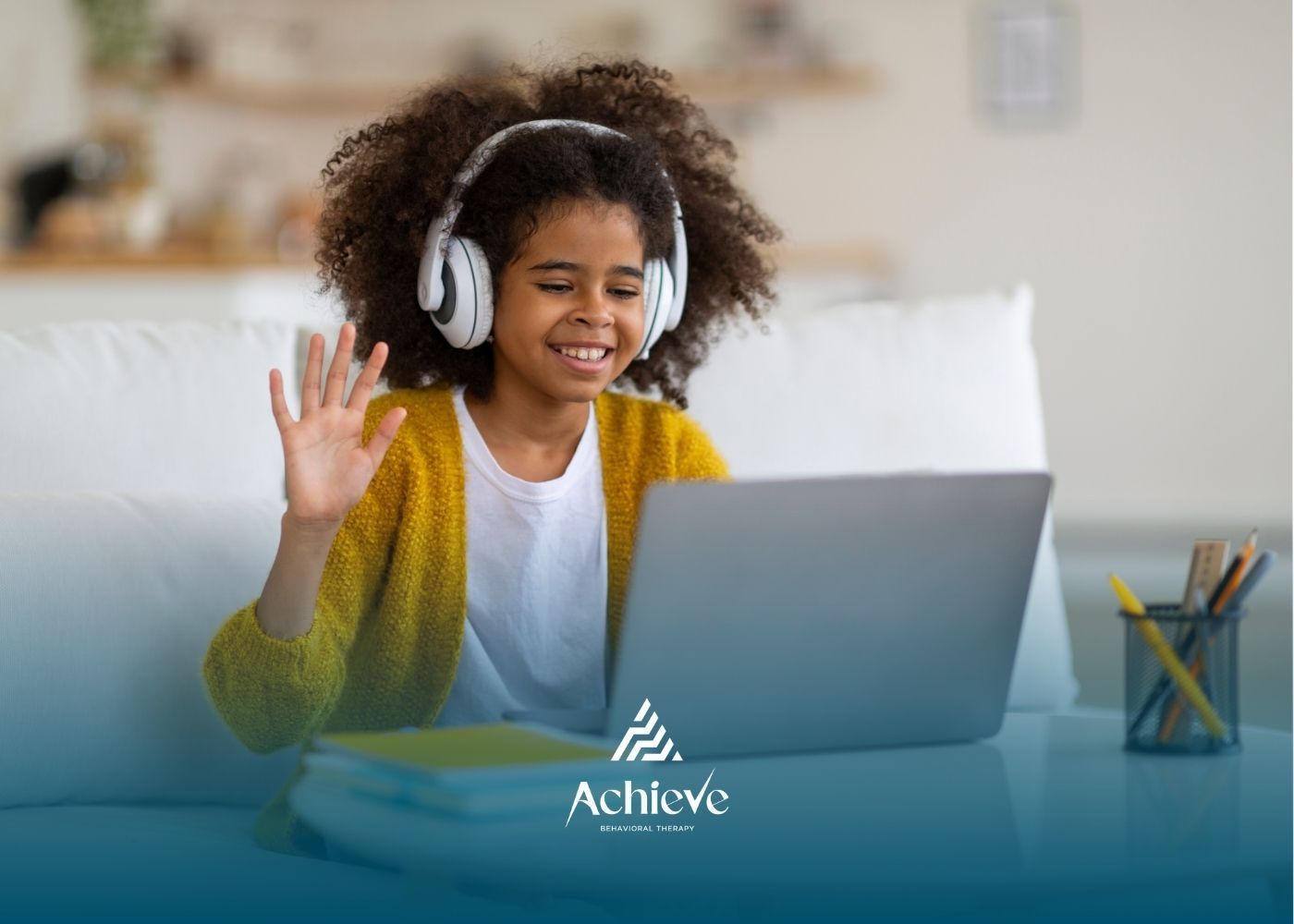 Woman smiles at a child with a backpack. They are outside a blue building, appearing to chat.