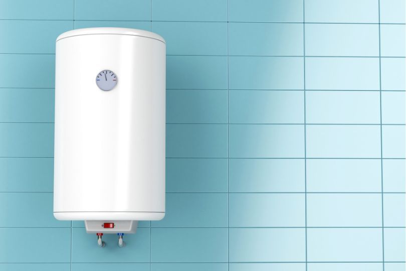 White bathroom heater on bright blue tiles.