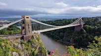 Large suspension bridge in the middle of the forest and above the river named River Avon.