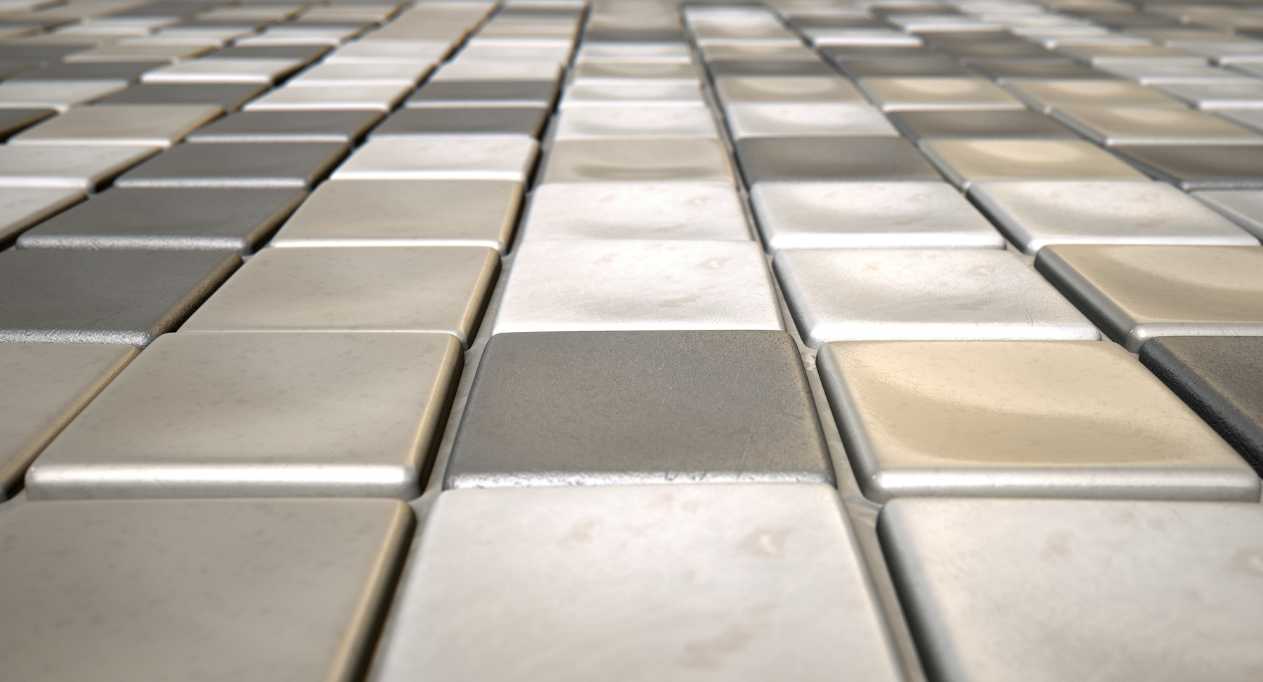 Close shot image of small white, grey and silver tiles.
