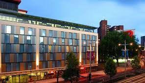 Lake in Bristol with a hotel named the future inn located in the background.