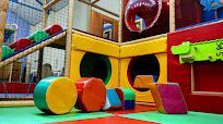 Kids play centre with yellow, red, blue, and green coloured materials.