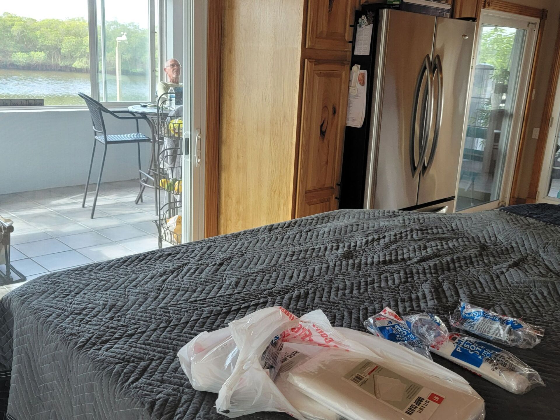 A bed with a bag of wipes on it in a kitchen.
