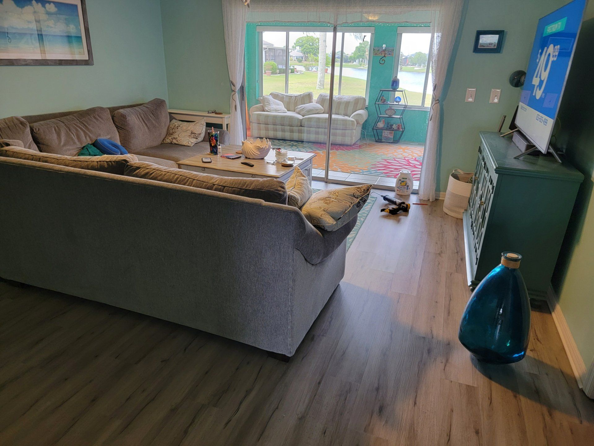 A living room with a couch and a television.