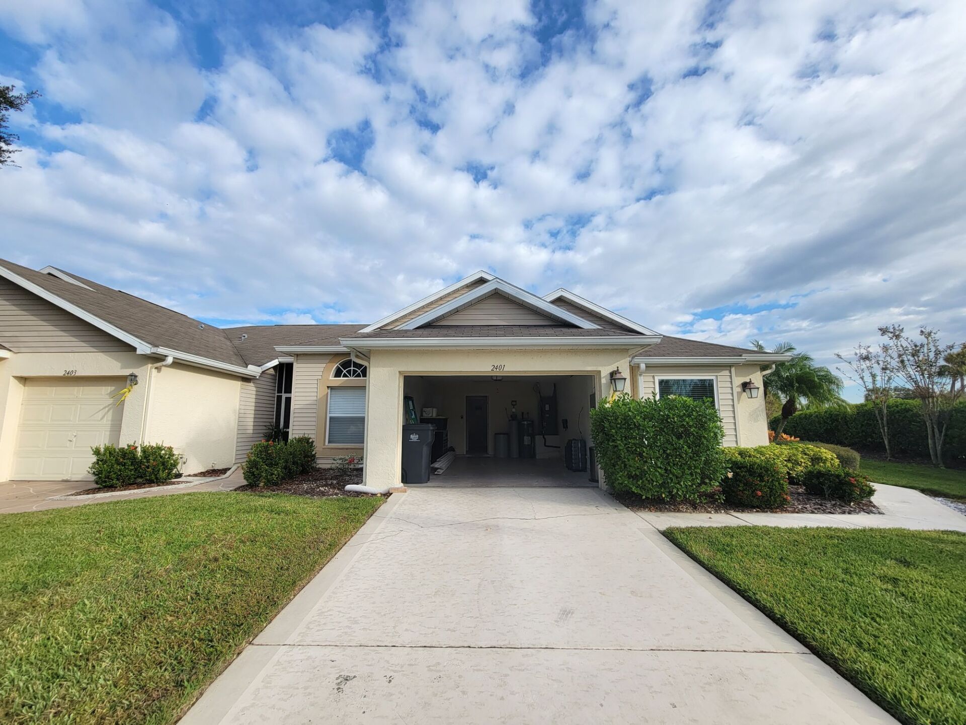 The front of a house with a driveway and a garage.