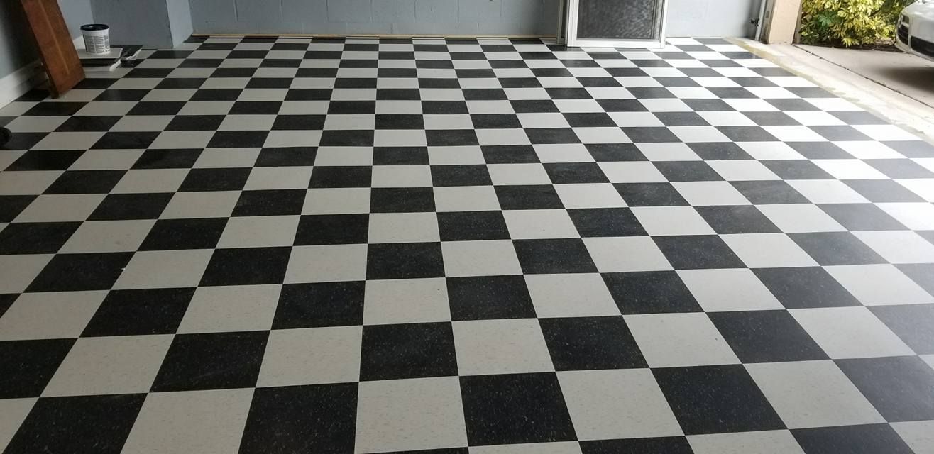 A black and white checkered floor in a garage