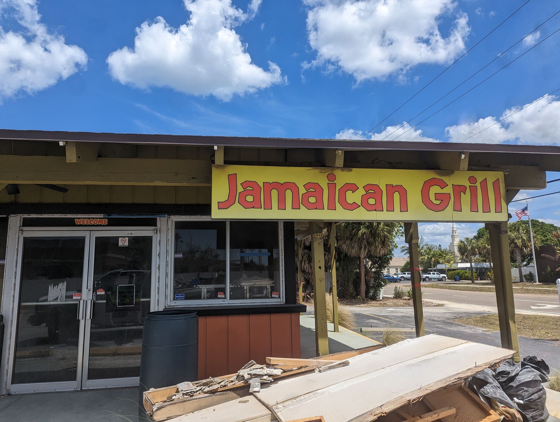 A restaurant with a sign that says jamaican grill