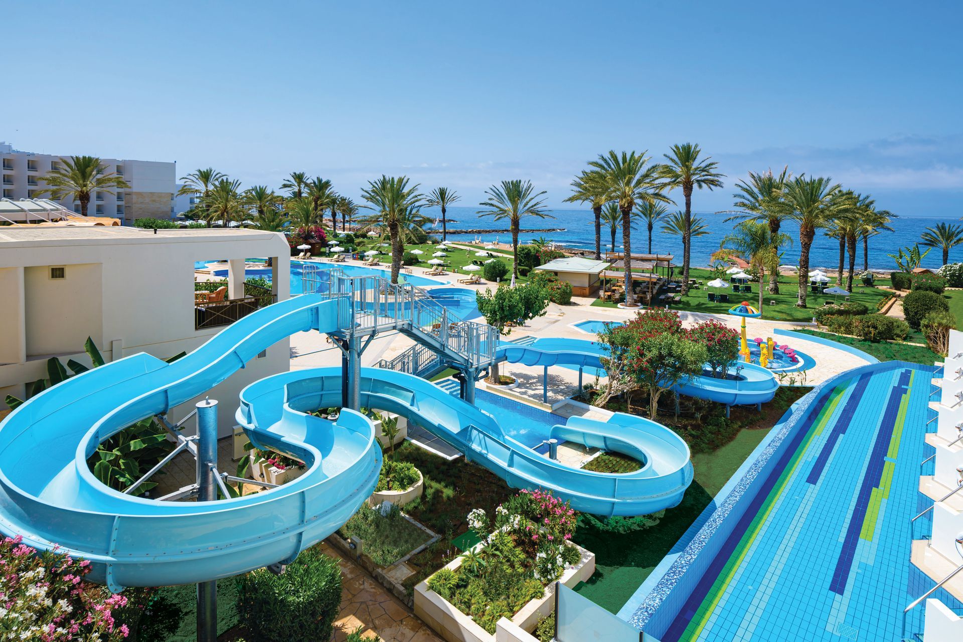 Family Holidays An aerial view of a water park with a water slide and a swimming pool