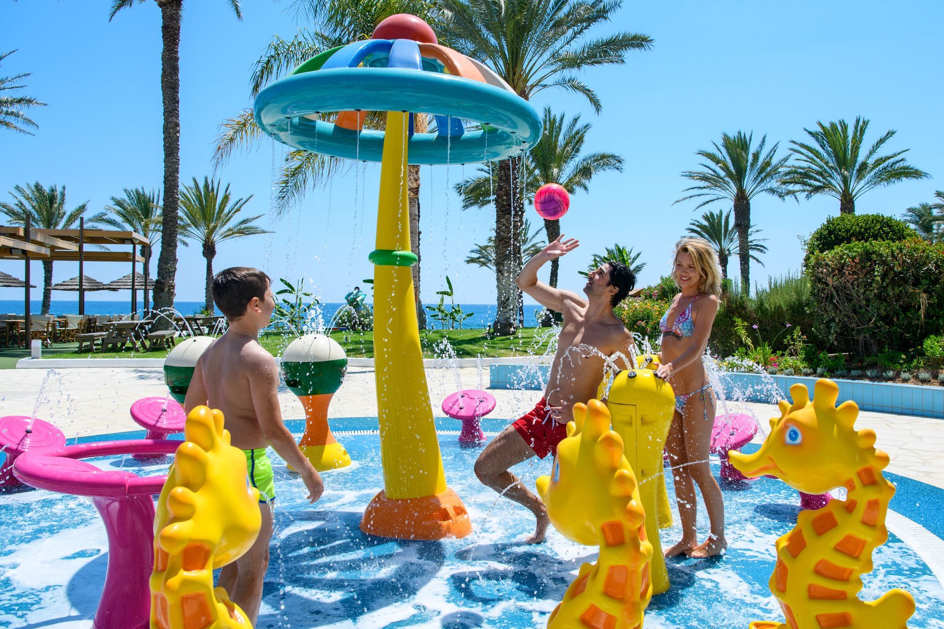 Constantinou Bros Hotels A group of people are playing in a water park.