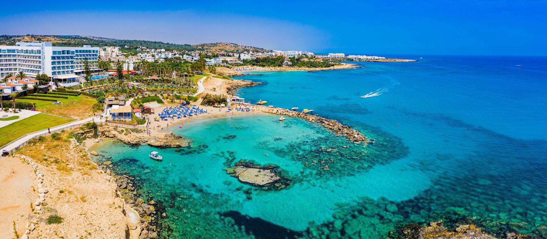 An aerial view of a beach in the middle of the ocean.