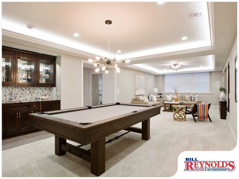 Finished basement with pool table, bar, and seating area. Brown, gray and neutral tones.