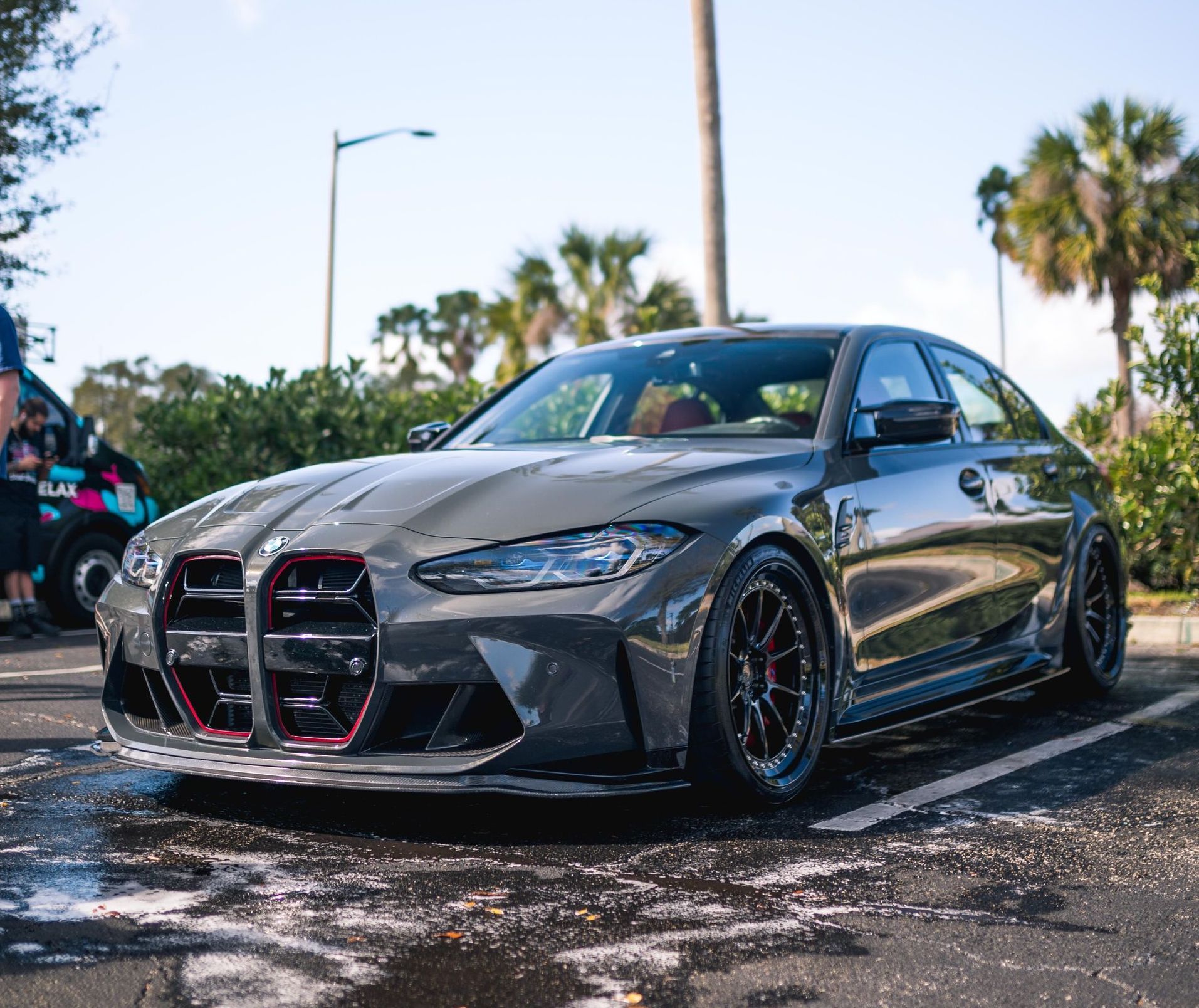 A bmw m3 is parked in a parking lot.