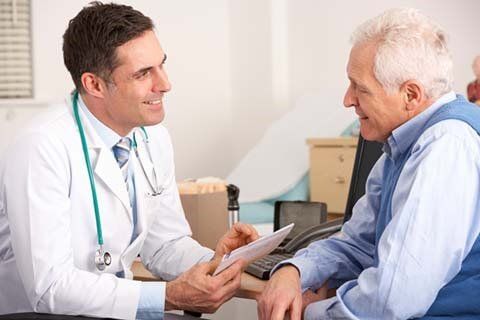 Doctor Talking to the senior man - Health Care Provider In Fayetteville, NC