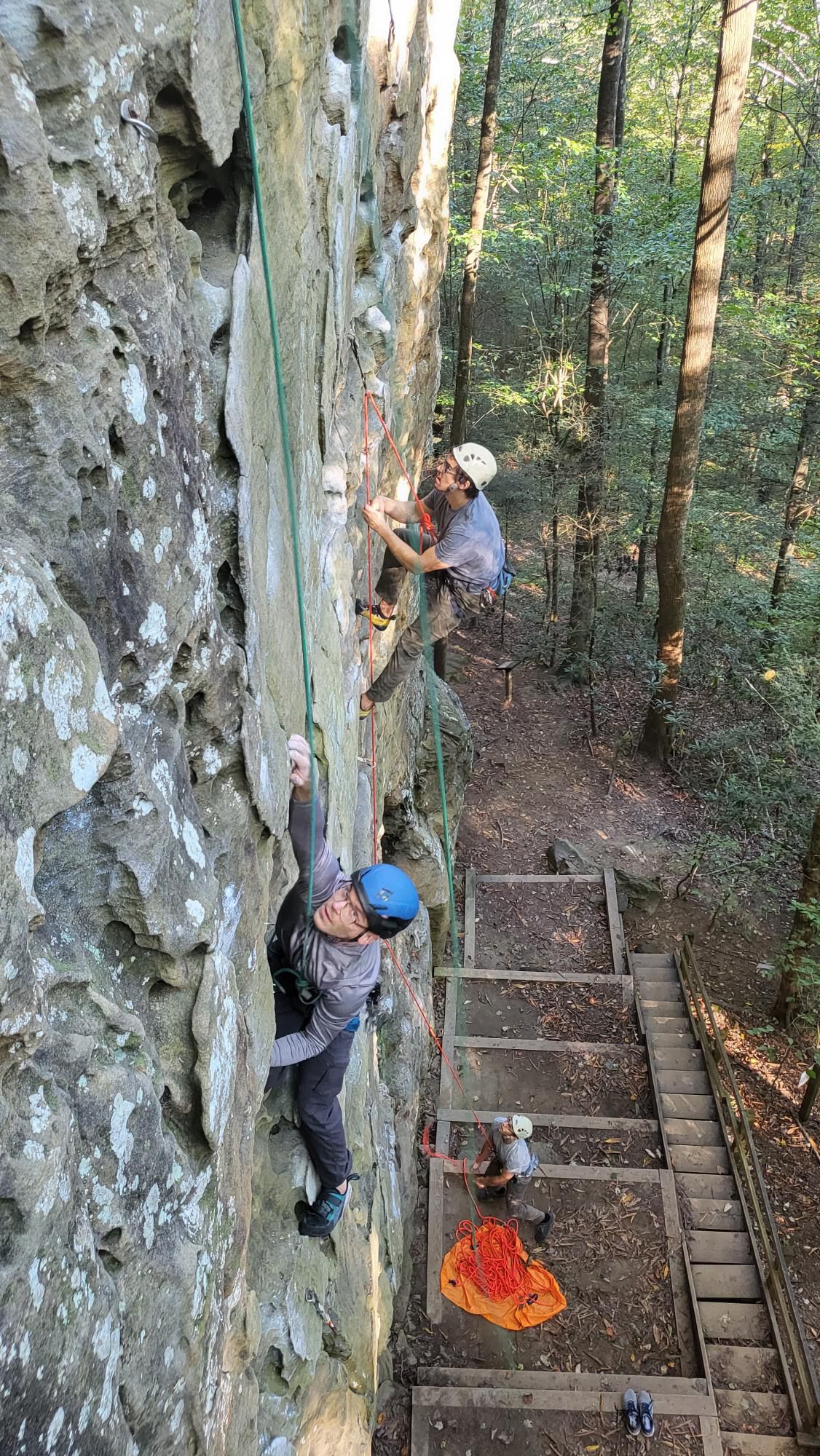 Beginner rock climbers with guide climb in Muir Valley in the Red River Gorge