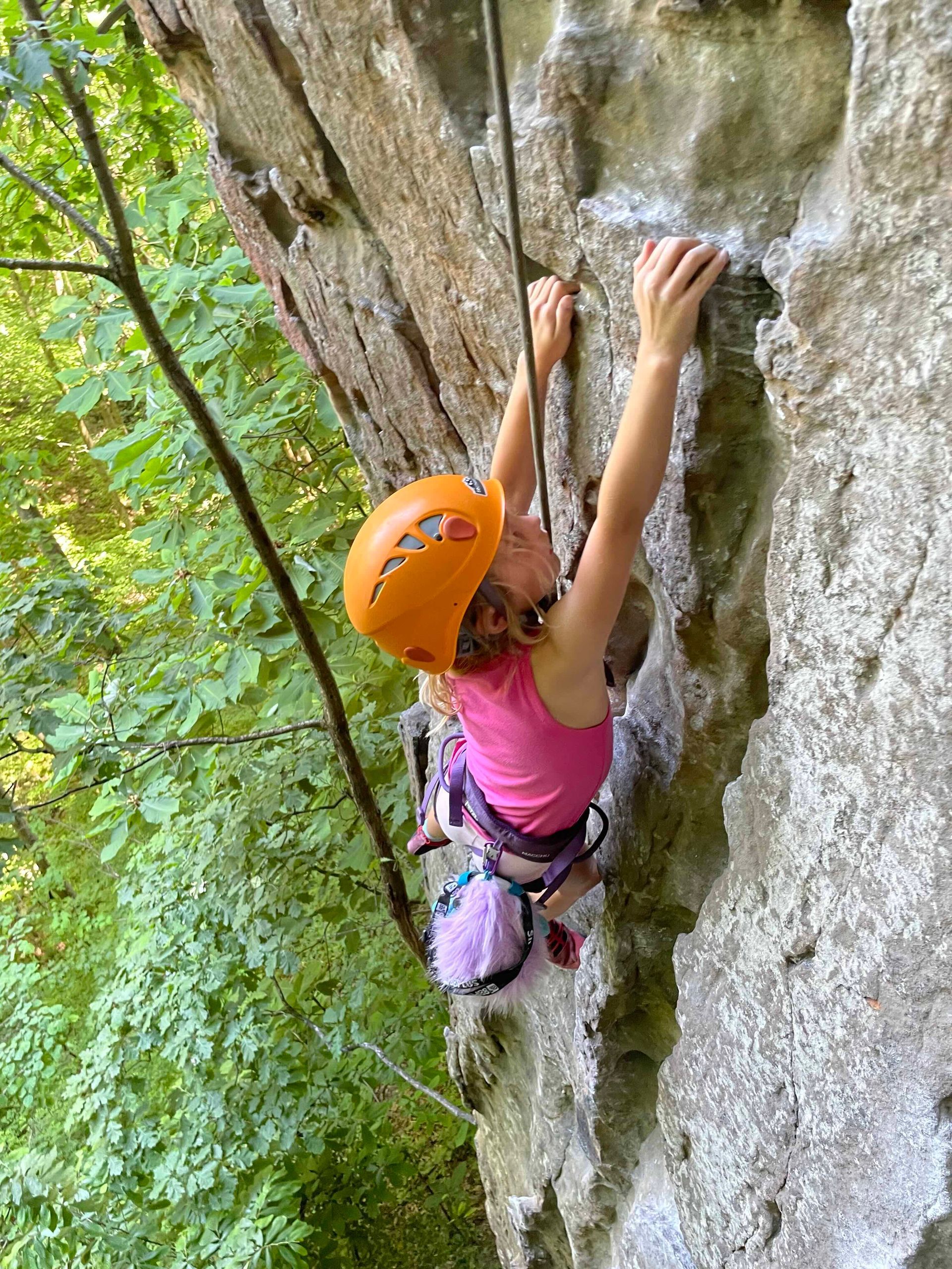 Child climbs with guide on perfect Red River Gorge sandstone