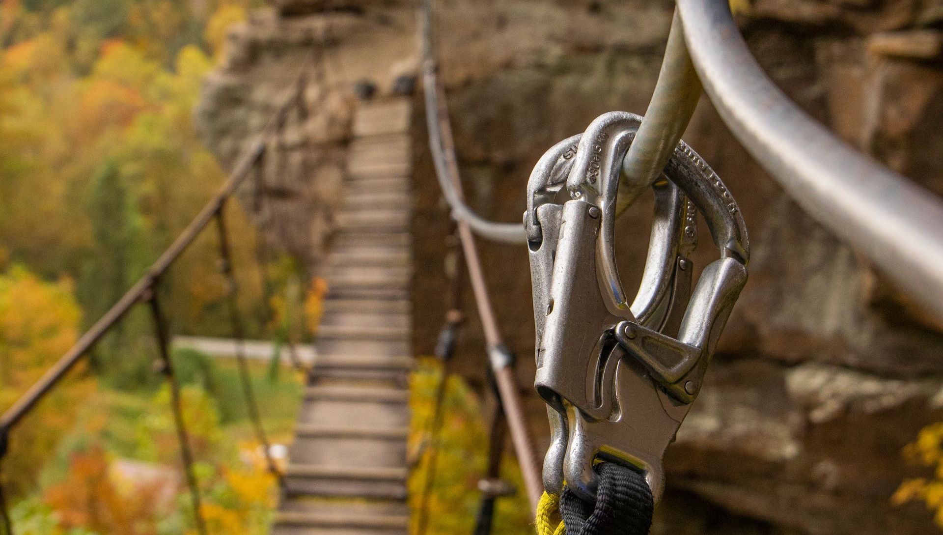 via ferrata climber is secured with safety device on red river gorge via ferrata