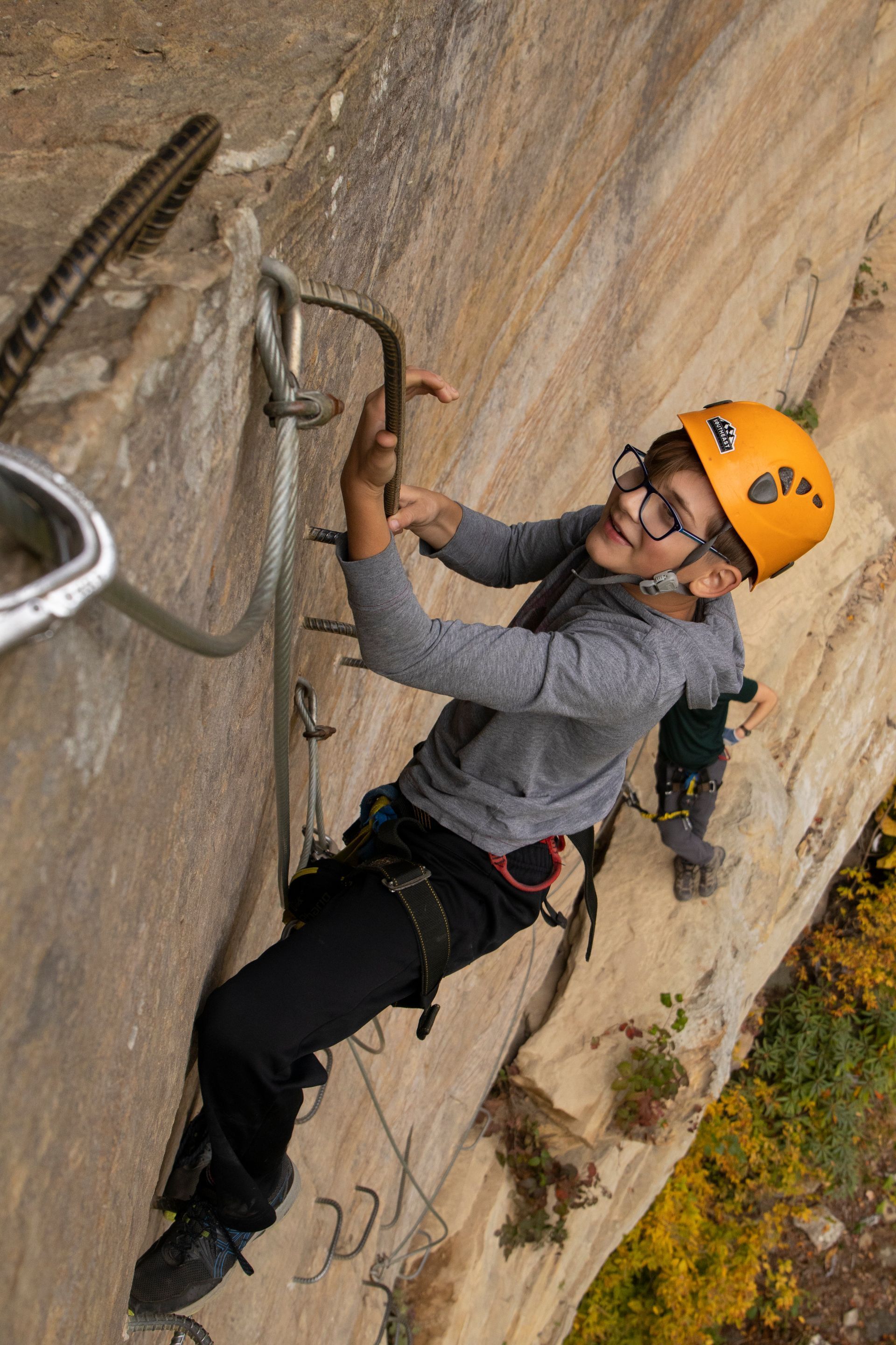 Child climbing on the Red River Gorge via ferrata