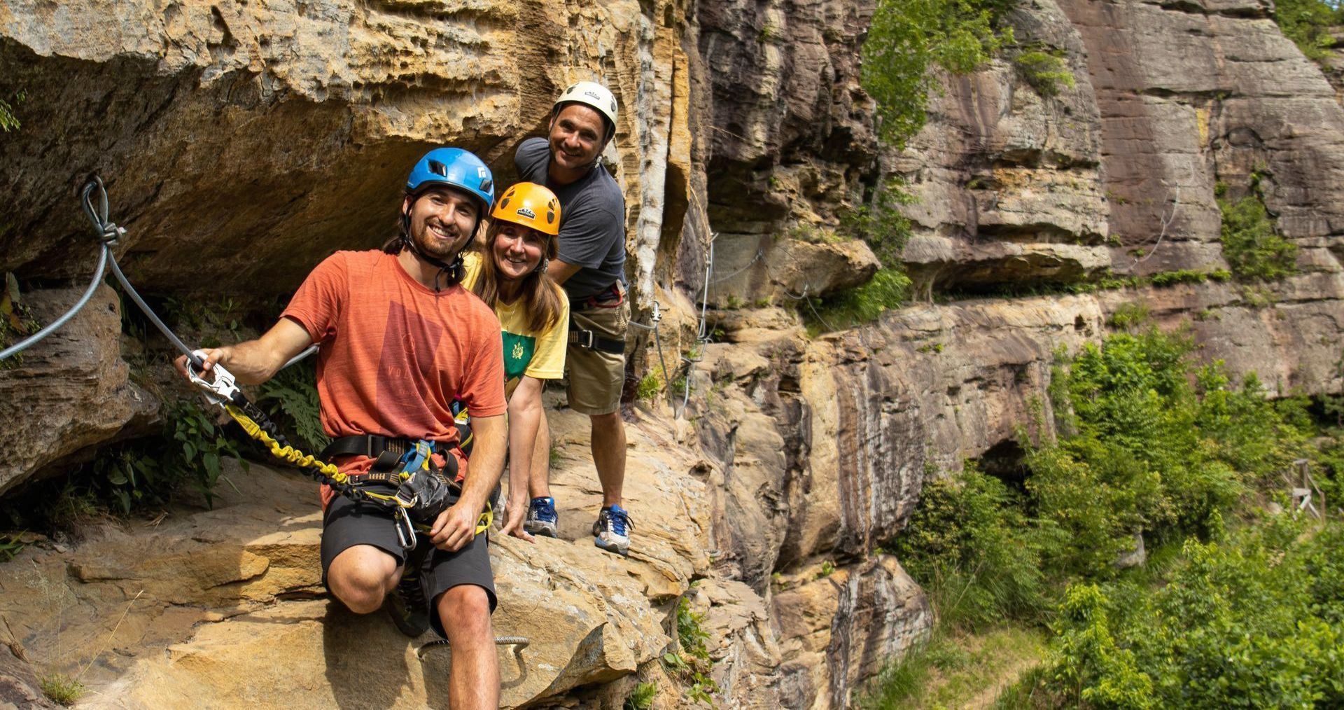 3 climbers make there way along the red river gorge via ferrata