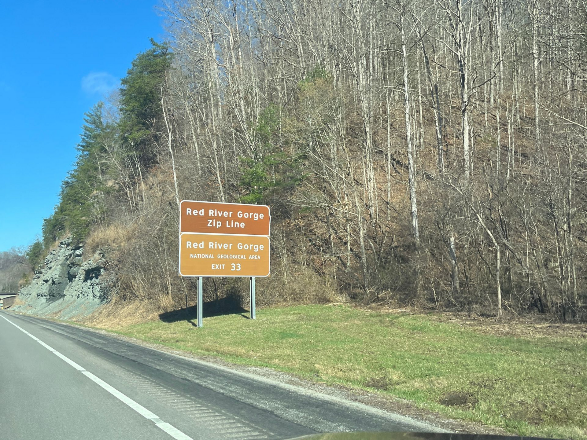 Road sign on a scenic Kentucky highway leading toward the Red River Gorge Geological Area