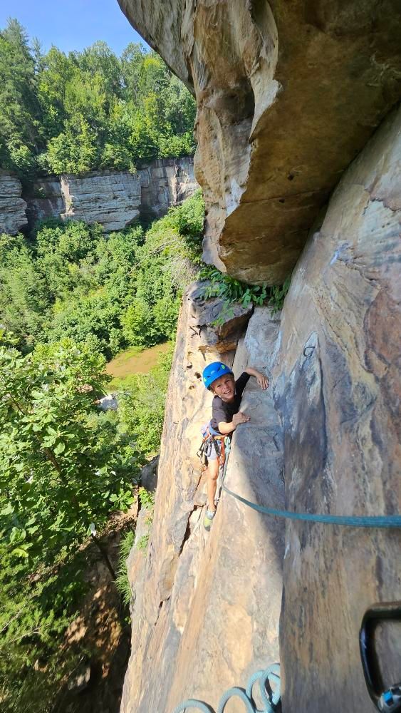 climbing guide and climber ascend route in the red river gorge