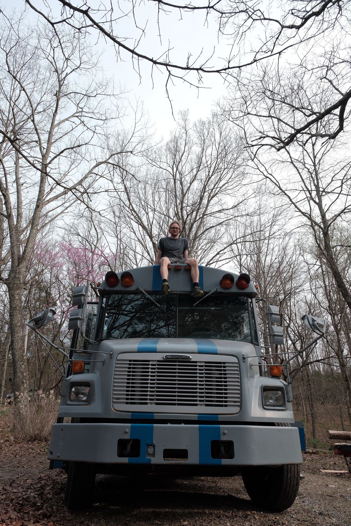 Red River Gorge shuttle van picking up hikers and climbers at a trailhead, ready for transport to po