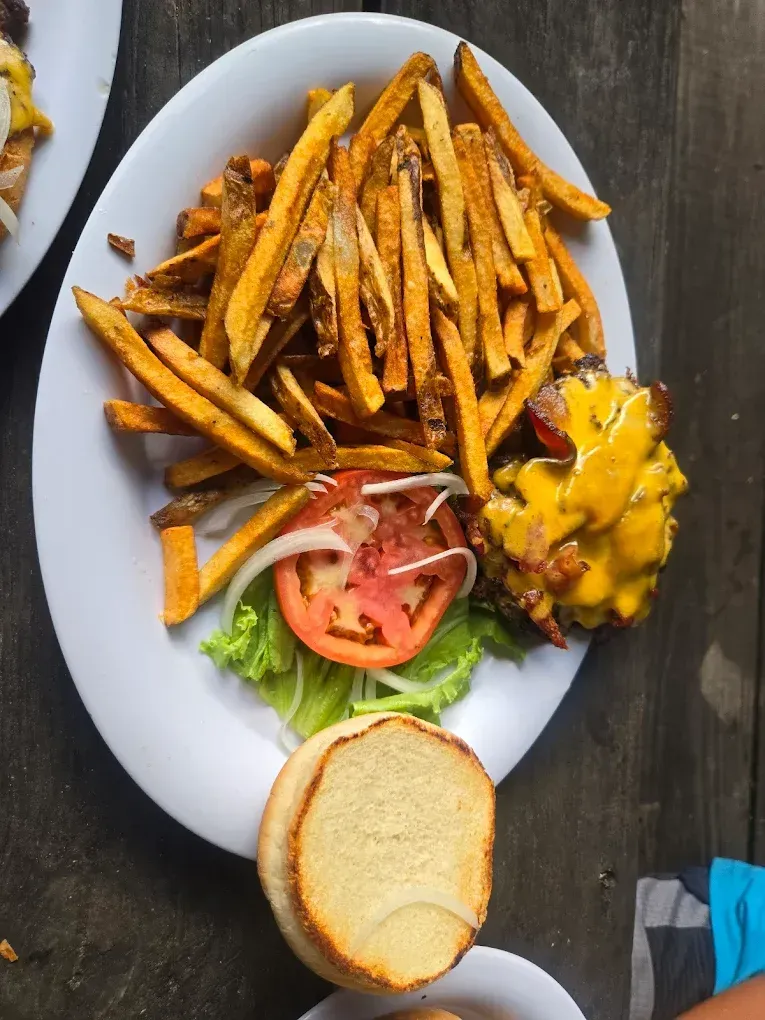 bacon cheeseburger and sweet potato fries at the red river rockhouse
