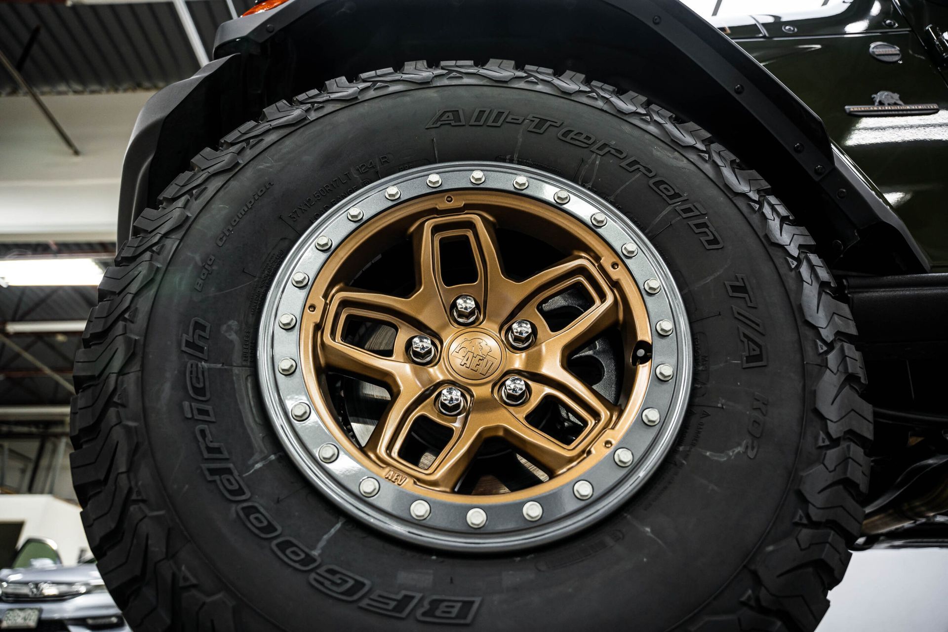 A close up of a tire and wheel on a car.