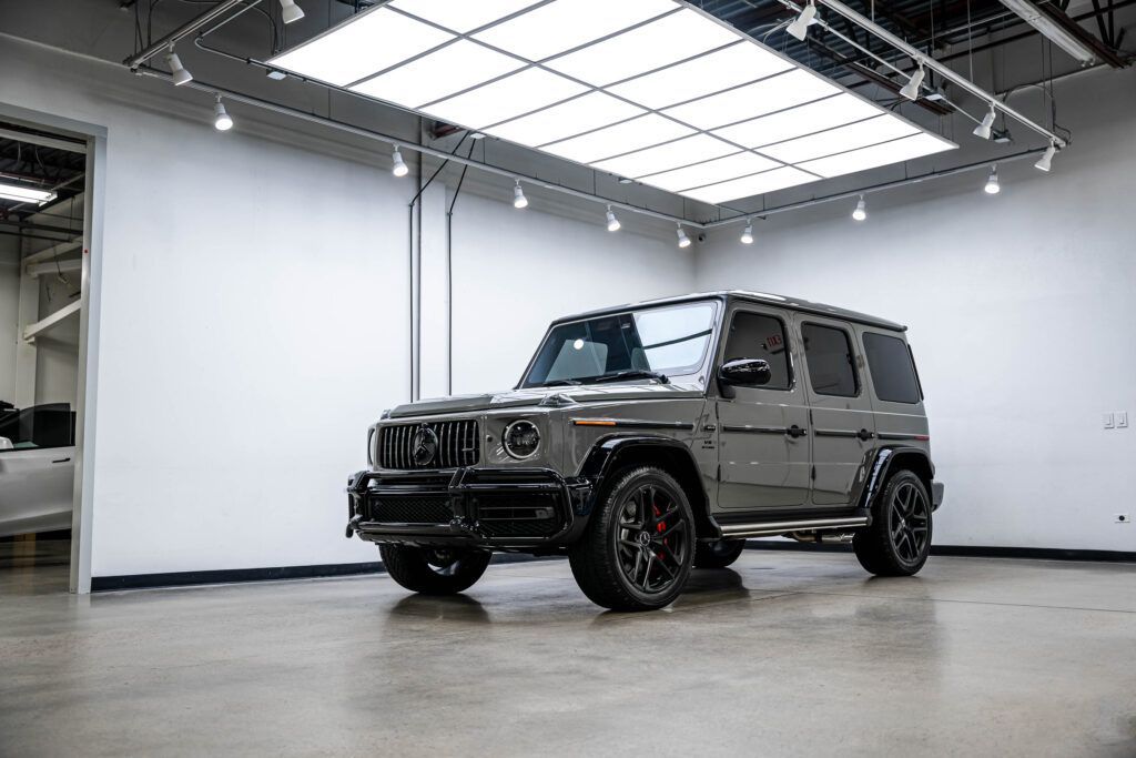 A mercedes benz g63 amg is parked in a garage.