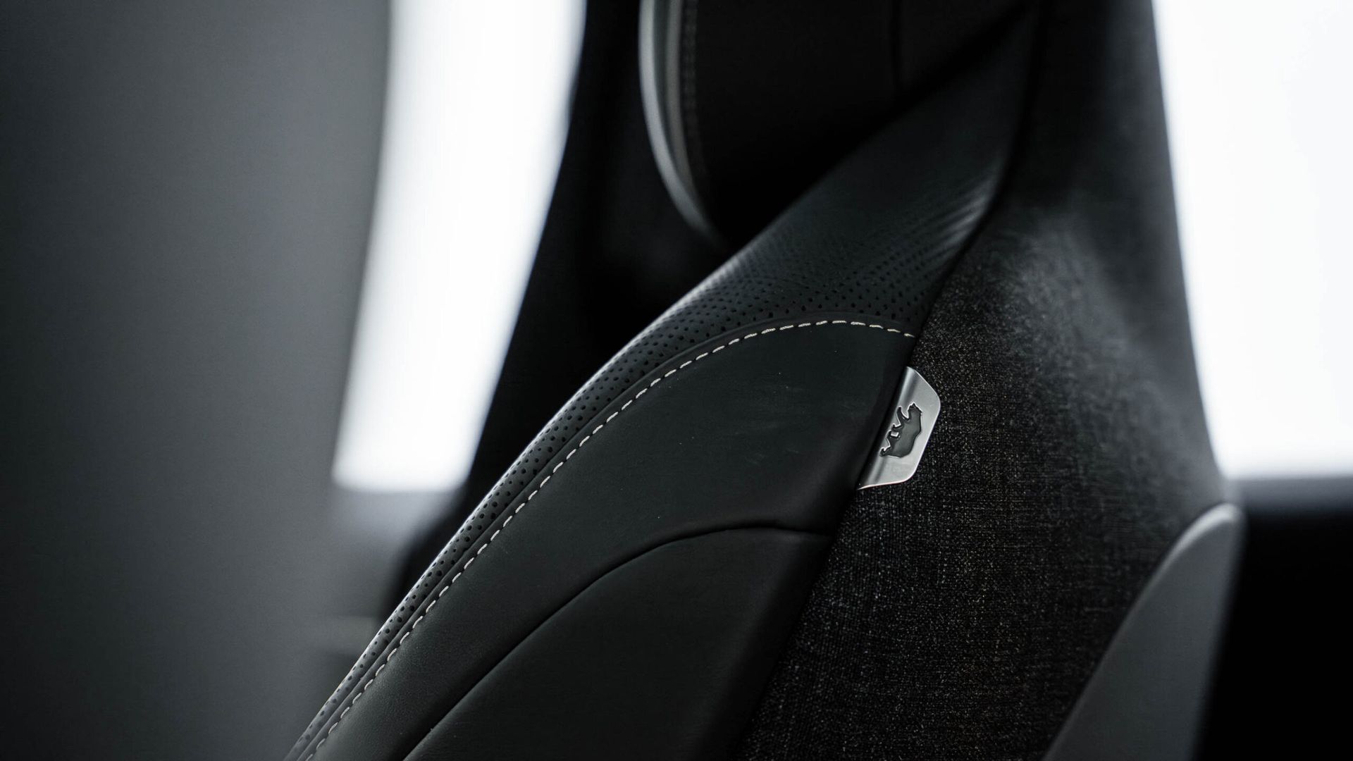 A close up of a car seat with airbag on it.