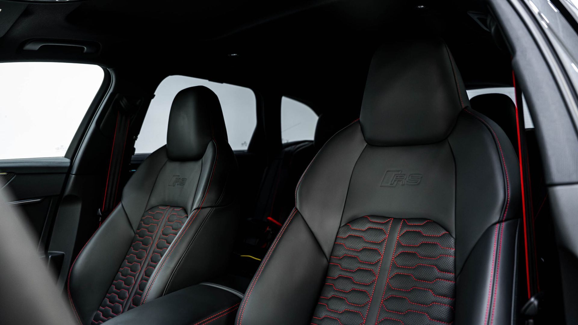 A close up of the front seats of a car.