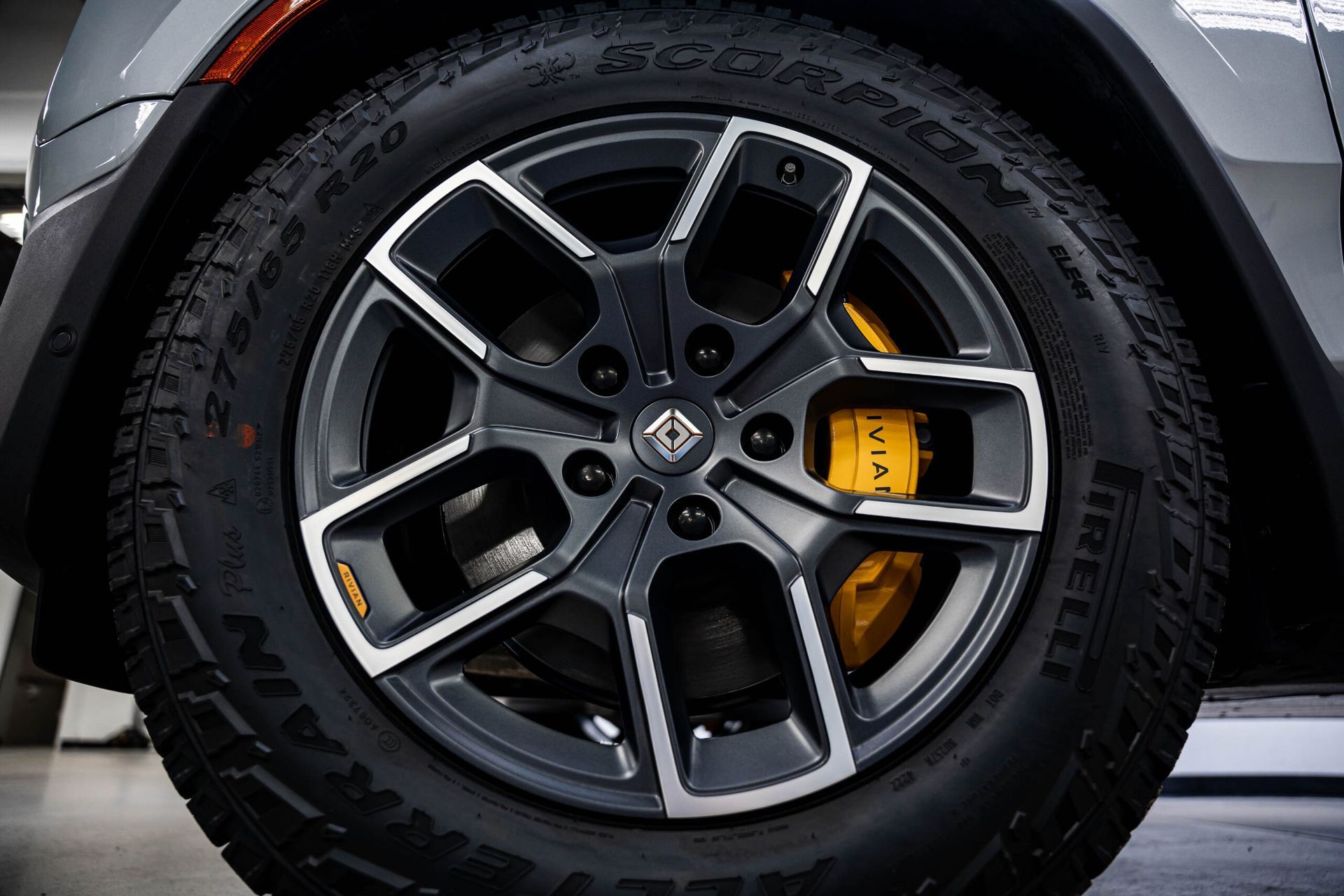 A close up of a car wheel with a tire on it.