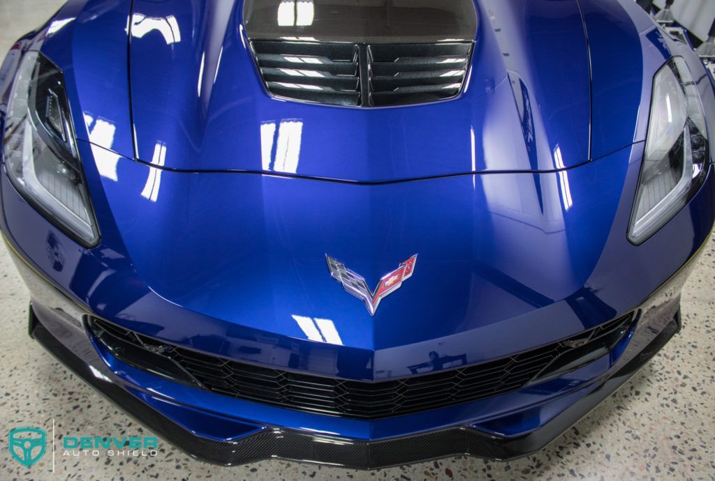 A blue sports car with the word drive on the front