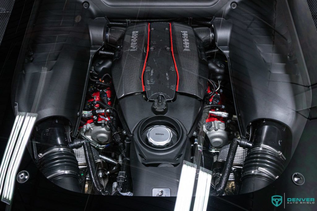 A close up of the engine of a ferrari 488 gtb.